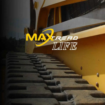 Mini excavator rubber tracks being cleaned and maintained