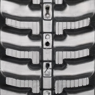Heavy-duty rubber track — tread pattern close-up