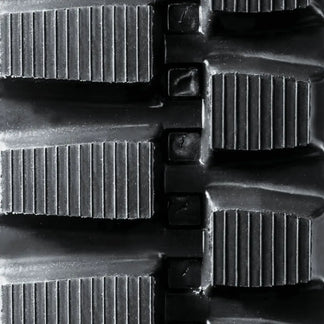 Heavy-duty rubber track — tread pattern close-up