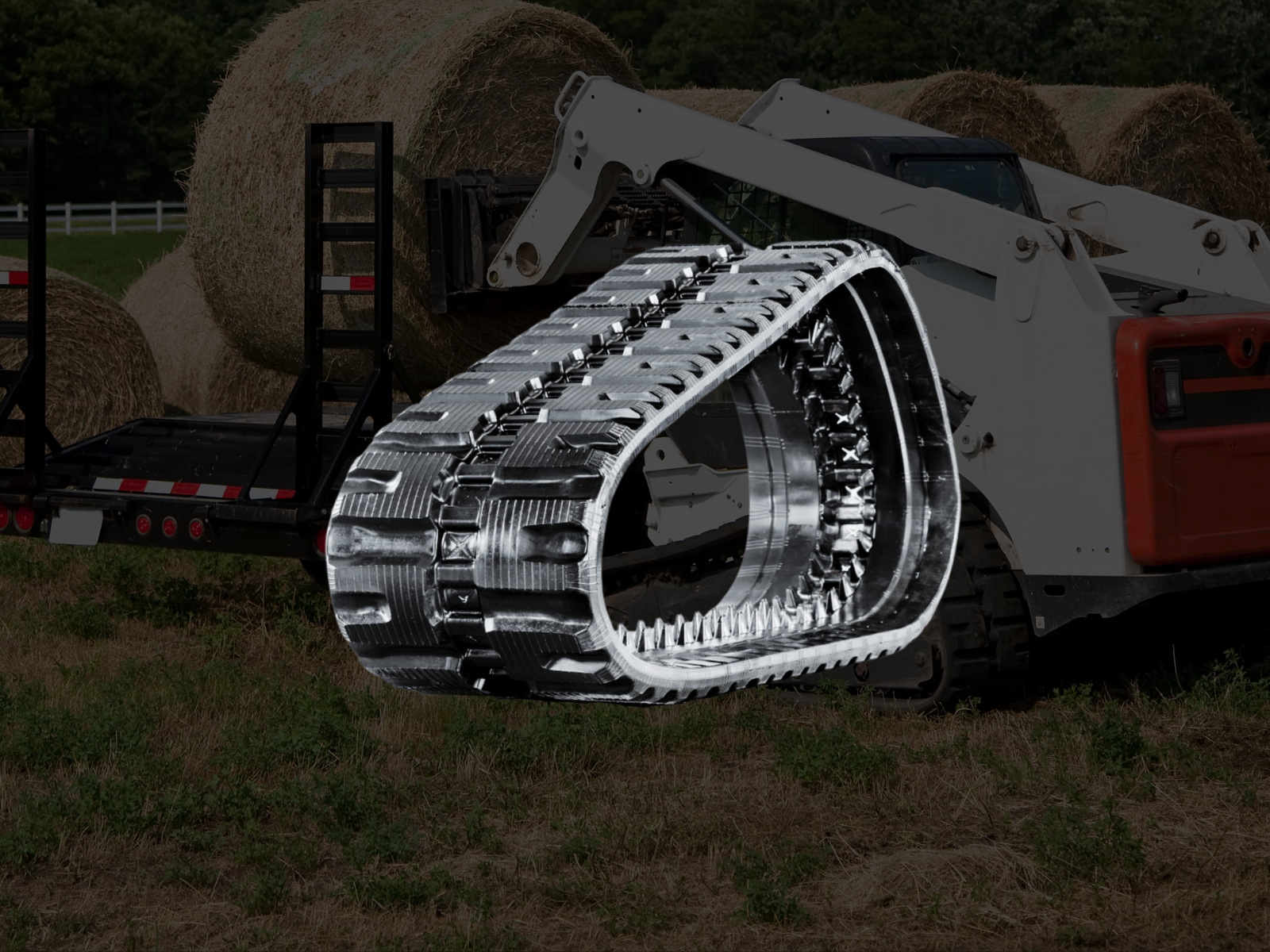 Skid steer C-Block tracks — high traction on rough jobsite terrain