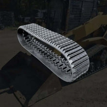 Heavy-duty rubber multi bar track for skid steer loader on construction site background