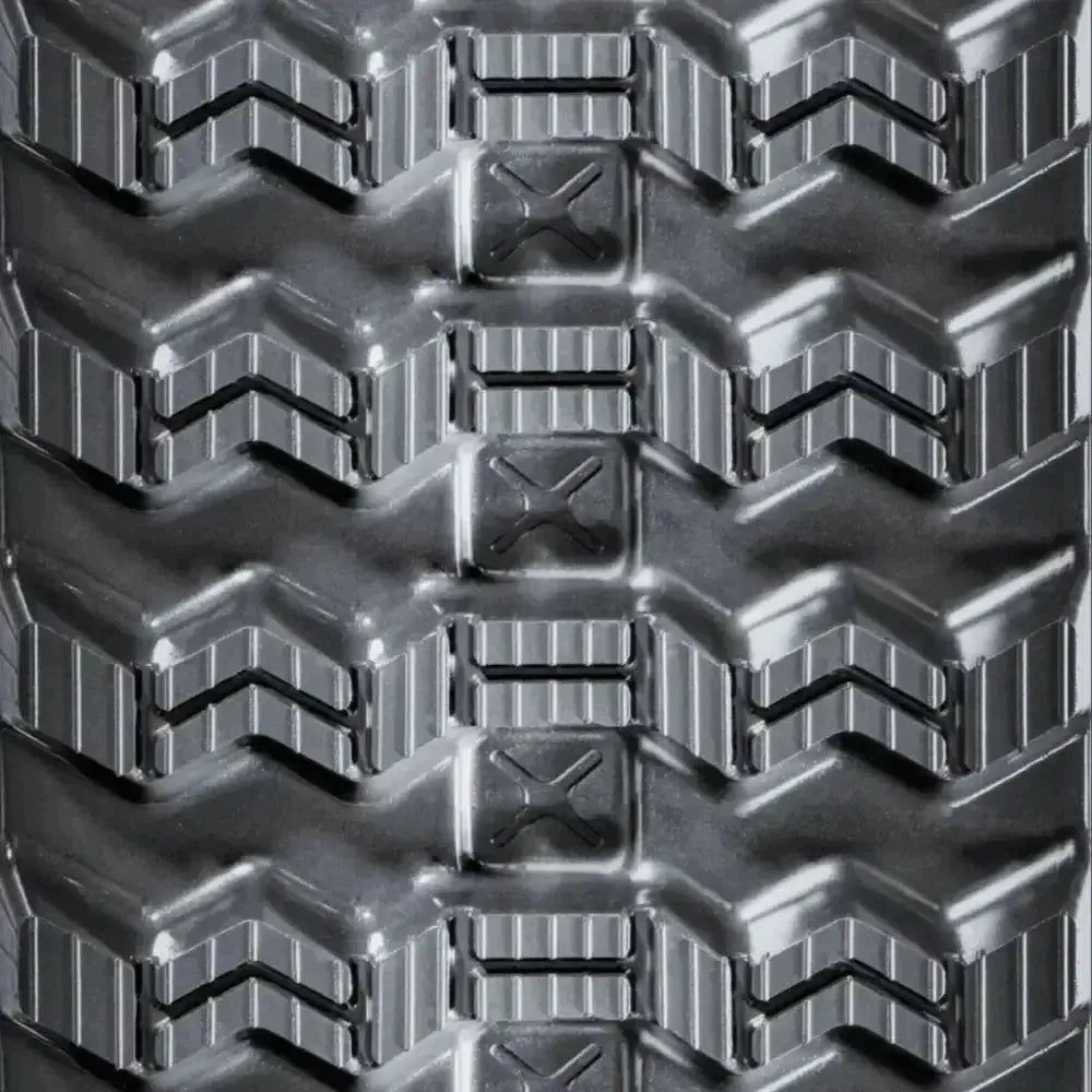 Takeuchi TL140 skid steer rubber track – C-Block tread close-up