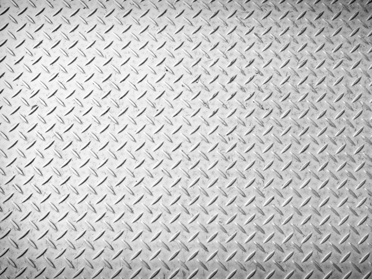Grayscale diamond plate steel with a textured, anti-slip surface