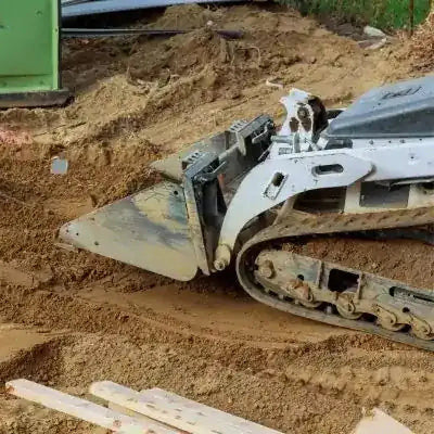 compact track loader with premium aftermarket tracks – drop-forged steel links – installed view