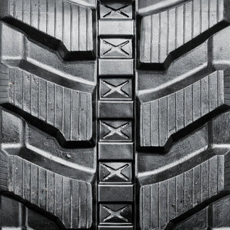 Heavy-duty rubber track — tread pattern close-up