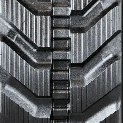 Directional rubber track tread pattern