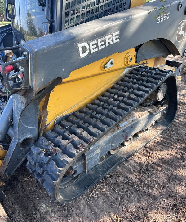 John Deere 333G compact track loader with X-Terrain rubber tracks — close-up fitment