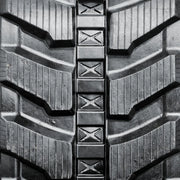 Directional rubber track tread close-up