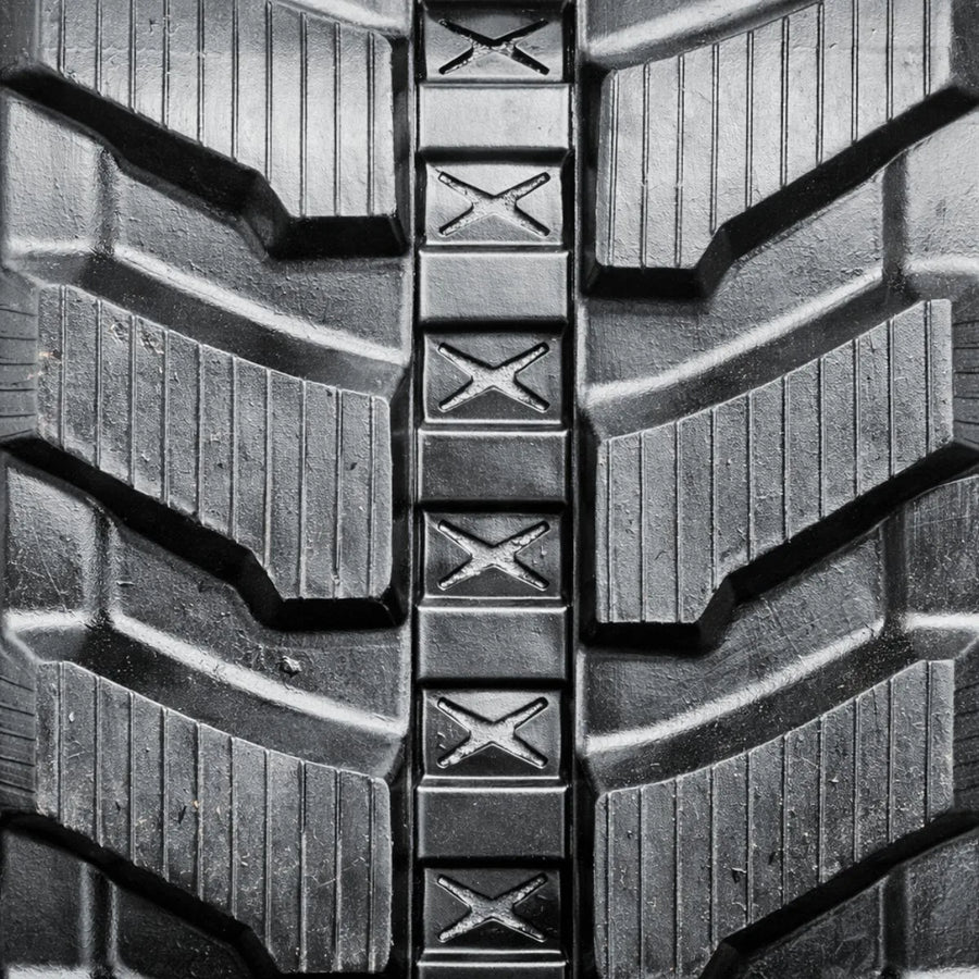 Directional rubber track tread pattern