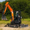 Kubota mini excavator with rubber tracks parked on dirt jobsite — replacement track fitment example