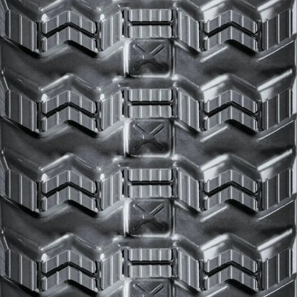 Takeuchi TL12 skid steer rubber track – C-Block tread close-up