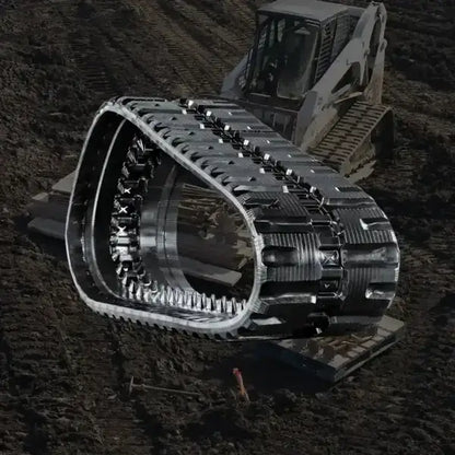 Rubber track for bobcat skid steers and compact construction equipment.