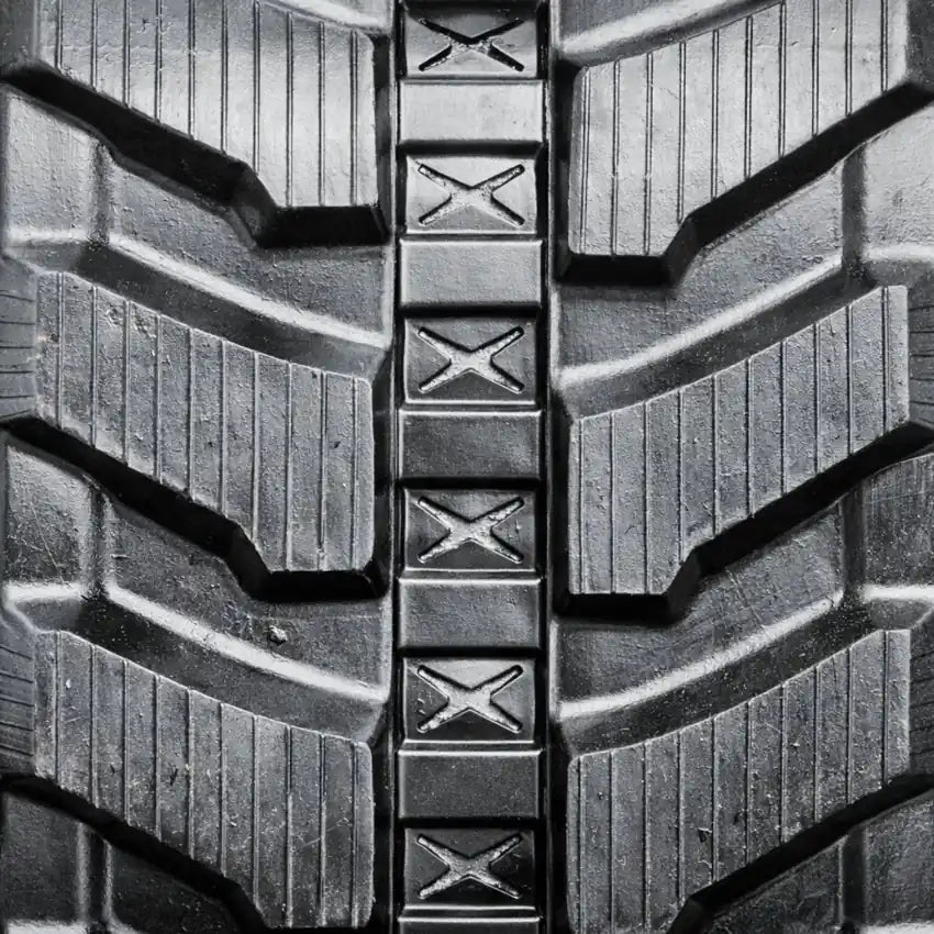 Directional rubber track tread pattern