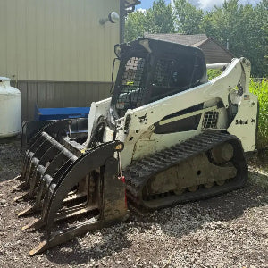 White Bobcat Skid Steer Loader Black Tracks Heavy Duty Grapple Attachment - tread close-up - TrackTECH
